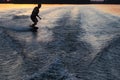 Wakeboarder making tricks on sunset Royalty Free Stock Photo