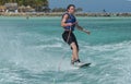 Wakeboarder Riding with Only One Hand in Aruba Royalty Free Stock Photo