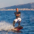 Wakeboarder in sunset.