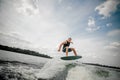 Wakeboarder trains at the river Royalty Free Stock Photo