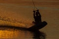 wakeboarder trains at sunset Royalty Free Stock Photo