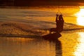 Wakeboarder trains at sunset Royalty Free Stock Photo