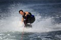 Wakeboarder in water splash