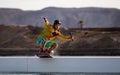 Wakeboarding sportsman on the slider in the cablepark