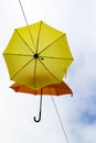 Wales, Caernarfon. Whimsical yellow and orange umbrellas. Royalty Free Stock Photo