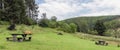 Wales countryside view of picnic benches in Hafren Forest park in summer