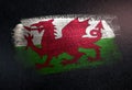 Wales Flag Made of Metallic Brush Paint on Grunge Dark Wall Royalty Free Stock Photo