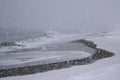 Walk along the beach during a snowstorm in Iceland Royalty Free Stock Photo