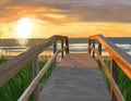 A walk along the boardwalk to the beach at sunset