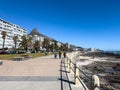 A walk along the Sea Point Promenade with Lions Head in the distance