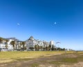 A walk along the Sea Point Promenade with paragliders and Lions Head in the distance