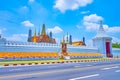 Walk along the wall of Grand Palace, observing decorations with portrait of King Rama X, Bangkok, Thailand