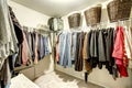 Walk-in closet with clothes