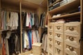 Walk in closet with organized clothing Royalty Free Stock Photo