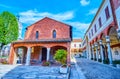 Walk in courtyard of Basilica of Sant\'Ambrogio in surroundings of ancient buildings of the complex, Milan, Italy
