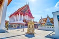 Walk in a courtyard of Wat Kanlayanamit temple in Bangkok, Thailand