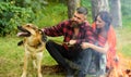Walk with dog concept. Woman and man on vacation Royalty Free Stock Photo
