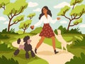 Walk with dog. Young woman and happy dogs on leashes in city park, owner and pets play outdoor, funny domestic animals Royalty Free Stock Photo