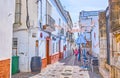 Walk the narrow Calle Boticas street, Arcos, Spain
