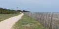 Walk path alley view of Baleines lighthouse in Ile de Re France in web banner template Royalty Free Stock Photo