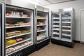 a walk-in refrigerator with shelves stocked with food and beverage products