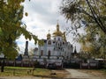 walk on the street of Kiev in the autumn afternoon view of the church and tall trees