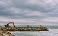 Walk to the lighthouse on the breakwater Royalty Free Stock Photo