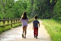 Friends Walking in nature on a path through forest Royalty Free Stock Photo