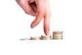 Walk up a stack of coins with fingers as success on white background concept of increasing income Royalty Free Stock Photo