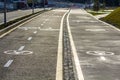 Walk way and bicycle lane signs on the asphalt road surface Royalty Free Stock Photo