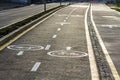 Walk way and bicycle lane signs on the asphalt road surface Royalty Free Stock Photo