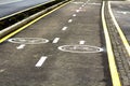 Walk way and bicycle lane signs on the asphalt road surface Royalty Free Stock Photo