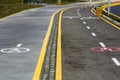 Walk way and bicycle lane signs on the asphalt road surface Royalty Free Stock Photo