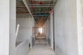 Walk way interior and scaffolding in construction building site with sun light tone Royalty Free Stock Photo