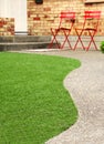 Walk way with Perfect grass landscaping with artificial grass in residential area Royalty Free Stock Photo