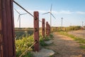 Walk way to power generation wind turbine Royalty Free Stock Photo