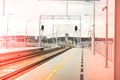 Walk way in train station with no people. Empty Passanger train railway station platform. Sign board with number of Royalty Free Stock Photo