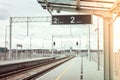 Walk way in train station with no people. Empty Passanger train railway station platform. Sign board with number of Royalty Free Stock Photo