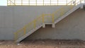 Walk way with yellow handrail inside factory