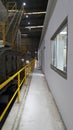 Walk way with yellow handrail in side of Paper machine