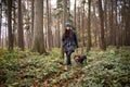 walk through the woods of young brunette aged 20-24 with her female Rough-coated Bohemian Pointer. Dominance of love relationship