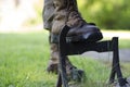 A walker cleaning the soles of walking boots