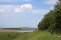 Walker on footpath along old railway, Cumbria