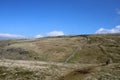 Distant walker on rough moorland footpath, Cumbria