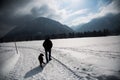 Walker in winter with dog