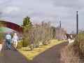 Walkers in Crescent City Park Along the Mississippi River Royalty Free Stock Photo