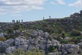 Walkers on a Jurassic karst rock ridge at El Torcal, Antequera, Andalucia. Royalty Free Stock Photo