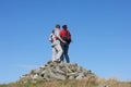 Walkers Standing On Pile Of Rocks Royalty Free Stock Photo