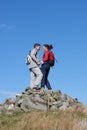 Walkers Standing On Pile Of Rocks Royalty Free Stock Photo