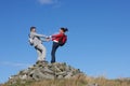 Walkers Standing On Pile Of Rocks Royalty Free Stock Photo